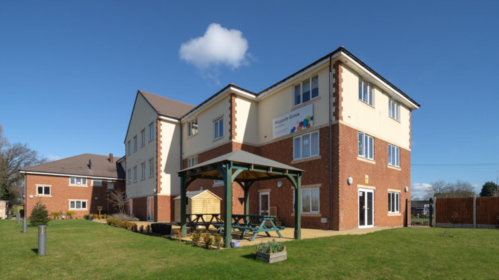 Maypole Grove care home, with surrounding gardens