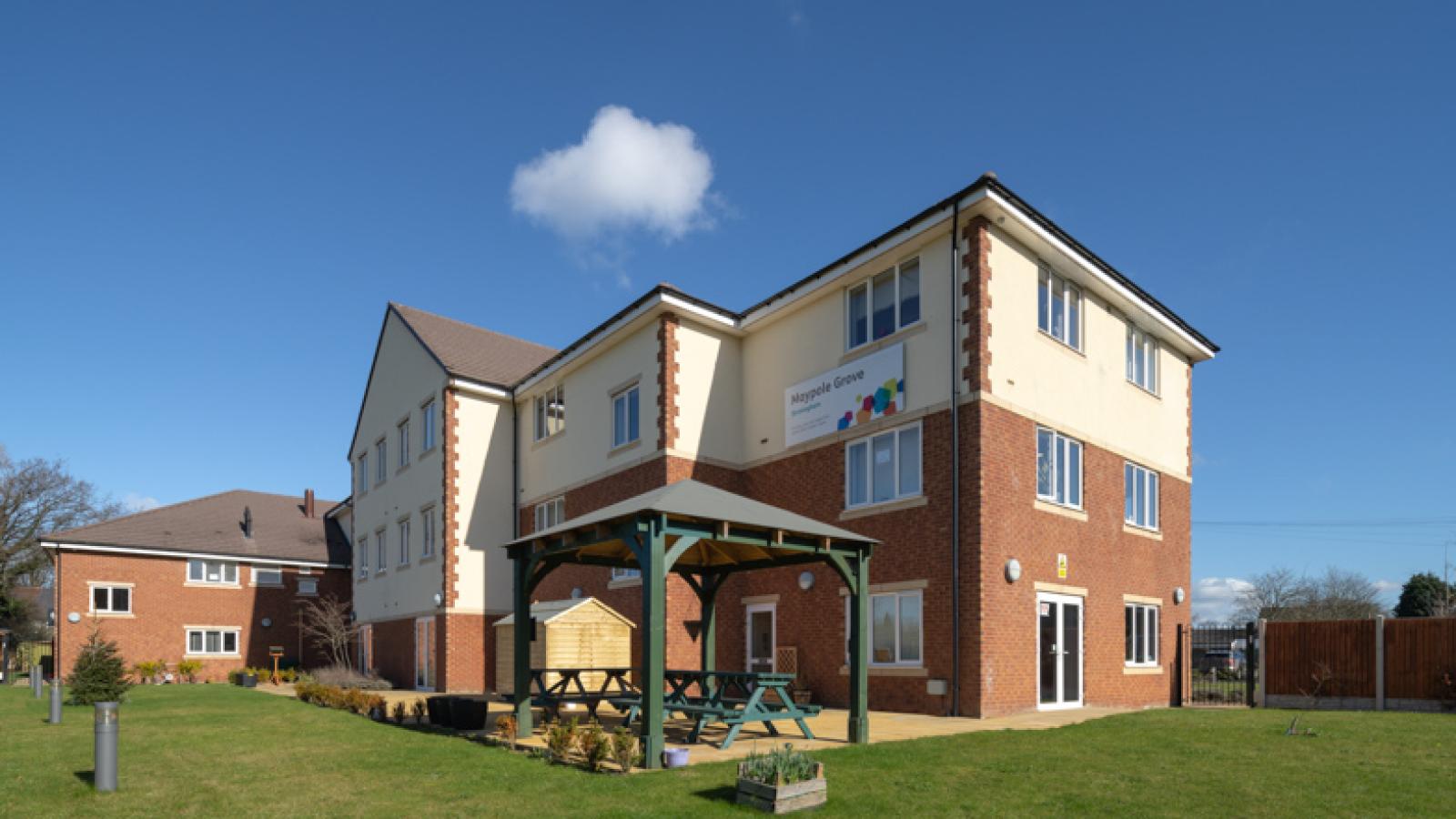 Maypole Grove care home, with surrounding gardens