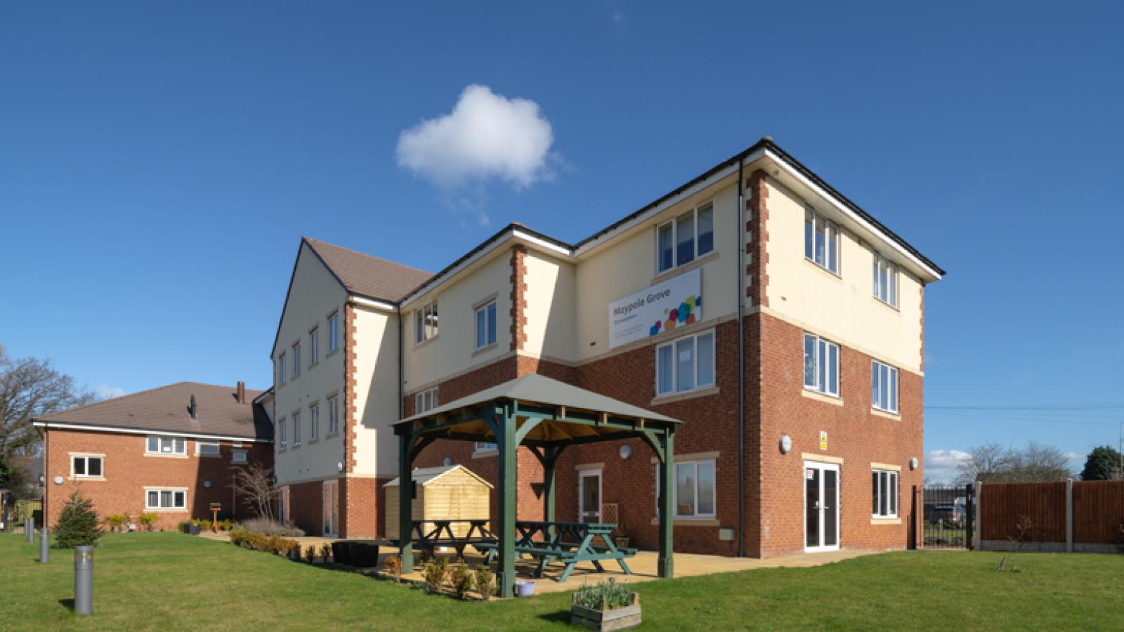 Maypole Grove care home, with surrounding gardens