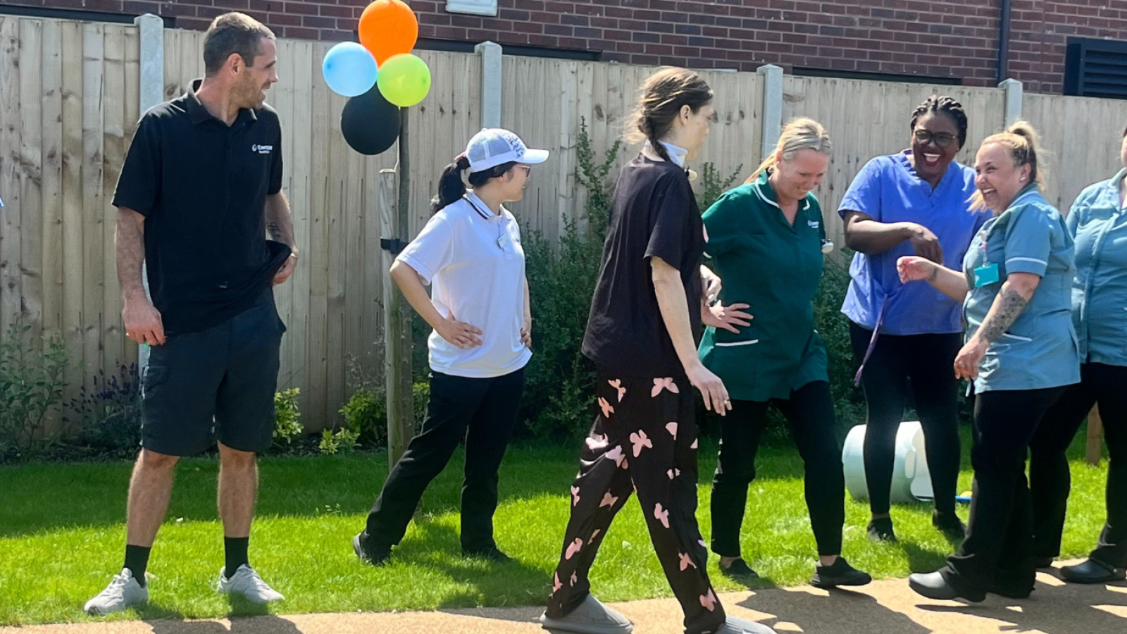 A group of people at work having fun in the garden