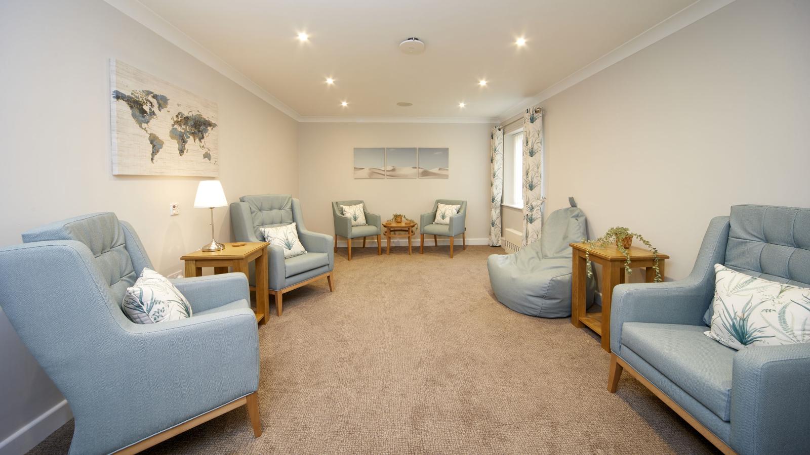 Care home quiet lounge with chairs, bean bags and tub chairs