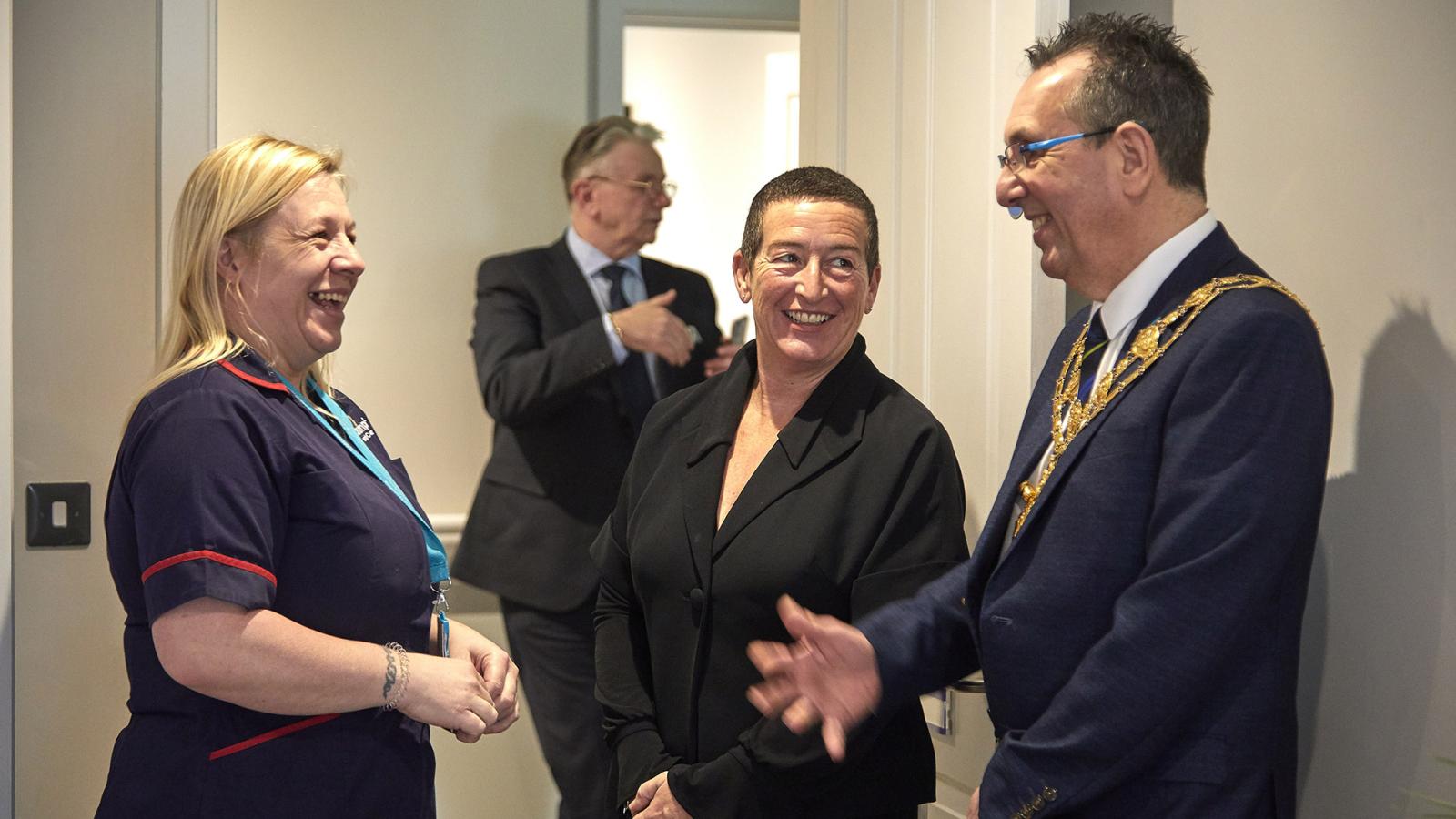 A nurse and Home Manager talk to the Mayor