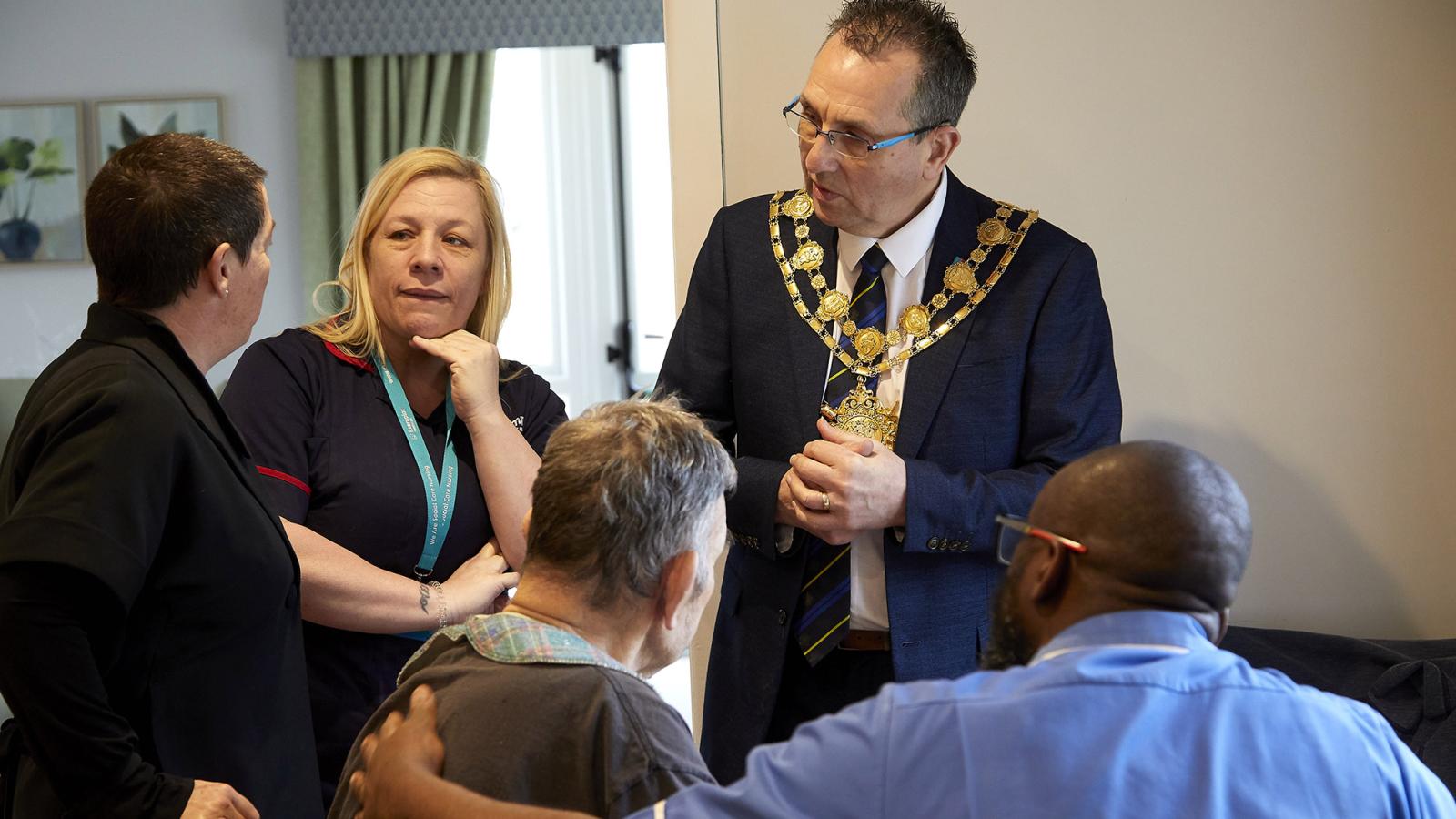 The Mayor speaks to colleagues and residents