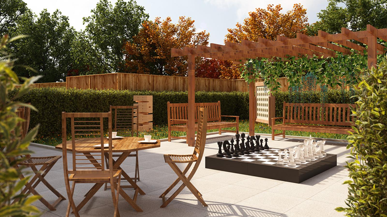 A virtual image of a garden with wooden tables and chairs and garden games, surrounded by landscaping and wooden fence