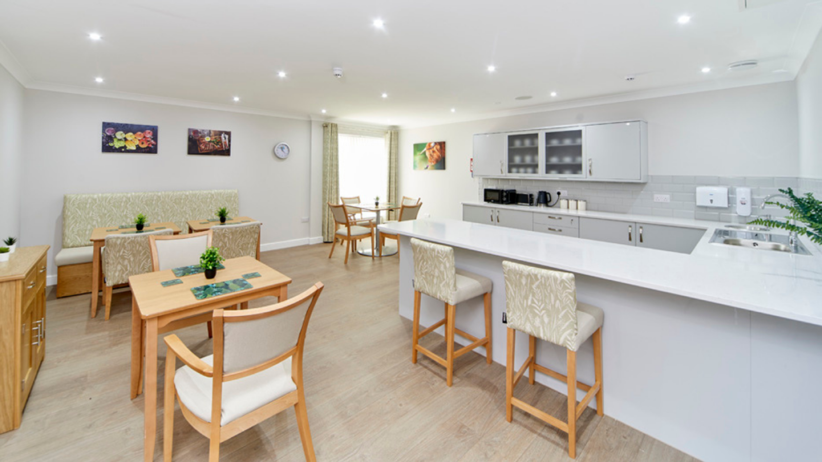 A dining room with different tables, chairs, bar table and stool chairs