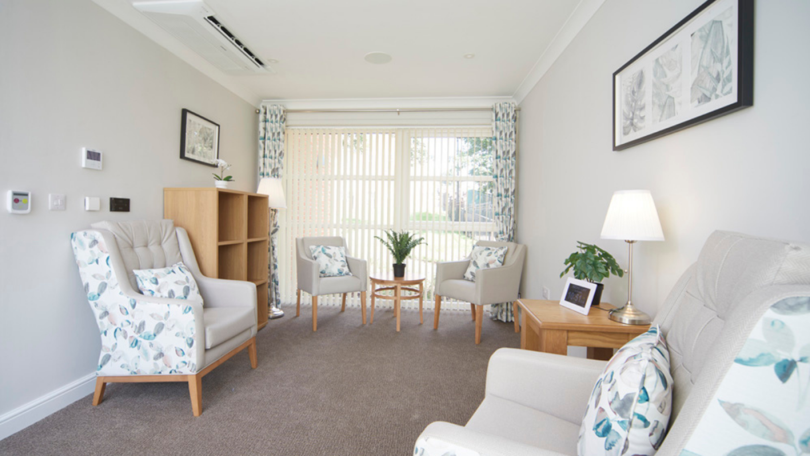A small lounge with different style chairs and tables