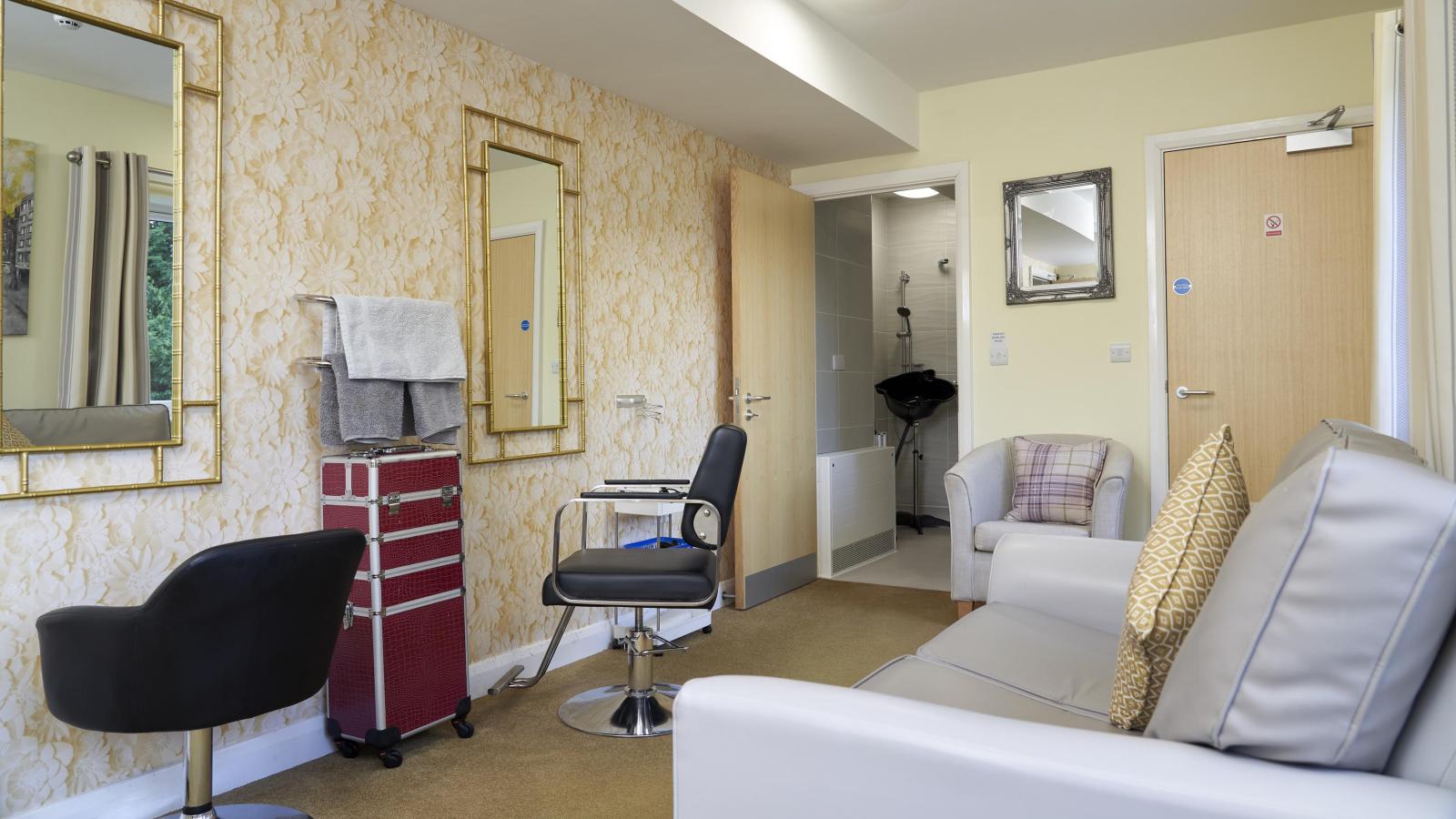 Beauty salon in a care home, with hairdresser chairs and nail bar