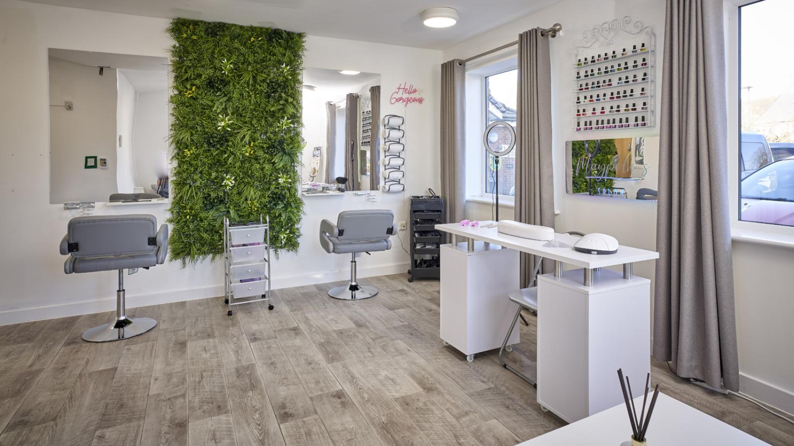 Beauty salon with two hairdressing chairs in front of mirrors